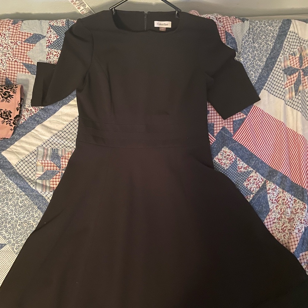 Calvin Klein size 6, to to knee/low thigh black modest dress with sleeves